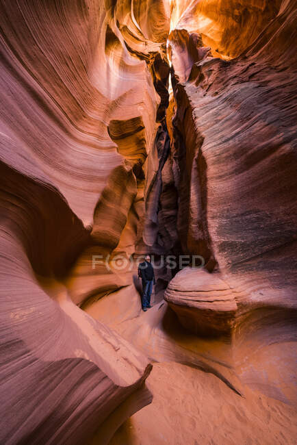 Man standing in a Slot Canyon known as Canyon X, near Page; Arizona, United States of America — Stock Photo