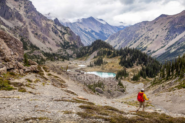 Male hiker in Royal Basin, Olympic Mountains, Olympic National Park; Washington, United States of America — Stock Photo