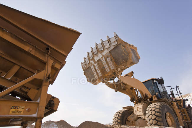 Separator and a front end loader at a construction site — Stock Photo