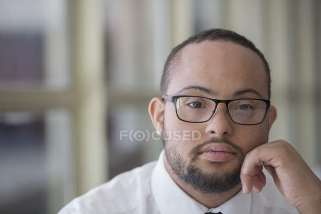 Portrait of African American man with Down Syndrome as a waiter in restaurant — Stock Photo