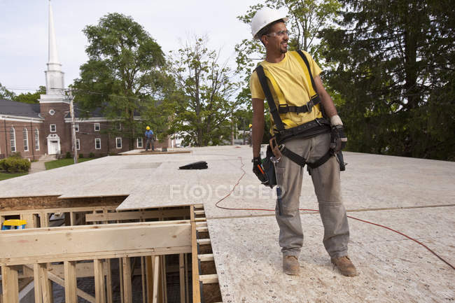 Carpenter standing on second floor particle board — Stock Photo