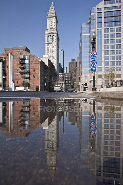 Custom House Tower reflected in a puddle at Rose Kennedy Greenway, Boston, Massachusetts, USA — Stock Photo