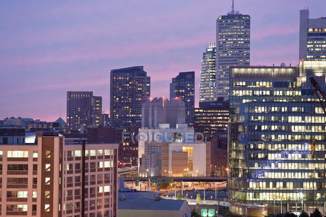 Buildings lit up at dusk, Seaport District, Boston, Massachusetts, USA — Stock Photo