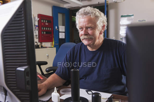 One engineer on computer starting up the water treatment plant in program for supervisory control and data acquisition — Stock Photo