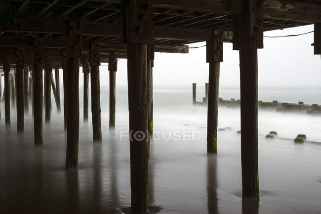 Fog and mist under the Playground Pier, Atlantic City beach; Atlantic City, New Jersey, United States of America — Stock Photo
