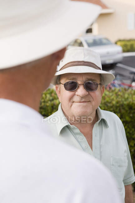 Senior man talking with another senior man — Stock Photo