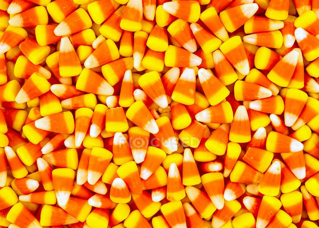 Closeup view of Many pieces of candy corn — Stock Photo