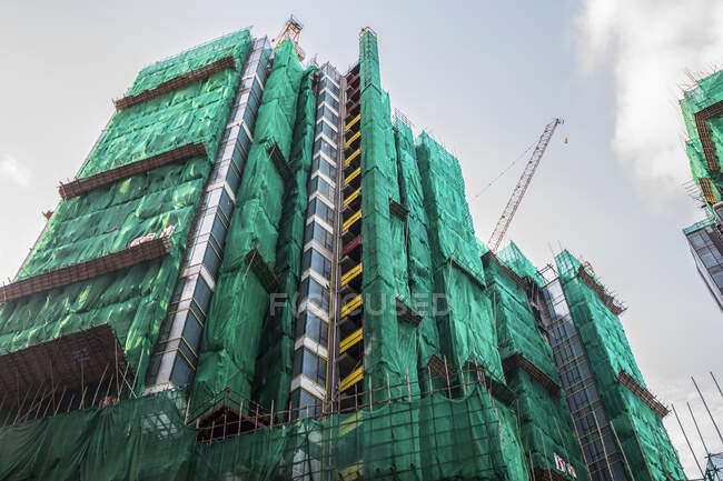Edifício de apartamentos de arranha-céus em construção; Hong Kong, China — Fotografia de Stock