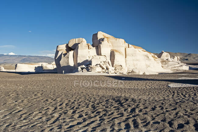 Large pile of pumice rock towers over the high desert sand; Antofagasta de la Sierra, Catamarca, Argentina — Stock Photo