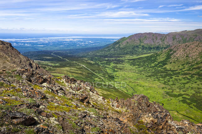 Outlooking Campbell Creek Valley and Anchorage, Chugach State Park, South-central Alaska in summertime; Anchorage, Alaska, United States of America — стоковое фото
