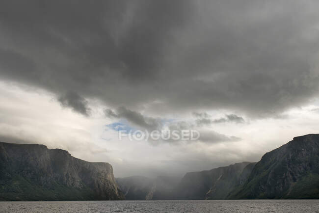 Clouds And Rainfall Over The Cliffs In Norris Point, Gros Morne National Park; Newfoundland, Canada — Stock Photo