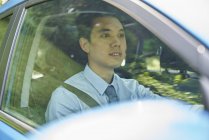 Young male driver in the car — Stock Photo