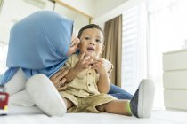 Mother and son in room during daytime — Stock Photo