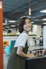 Young asian business woman playing in table soccer in modern office — Stock Photo