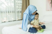 Mother and child in room interiror — Stock Photo