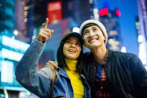 Young asian couple in time square — Stock Photo