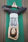 Young sporty asian woman making yoga — Stock Photo