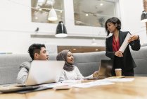 Young multicultural business people working in modern office — Stock Photo