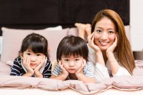 Mom and children together looking at the camera. — Stock Photo