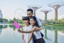 Family taking a selfie at Gardens by the Bay, Singapore — Stock Photo