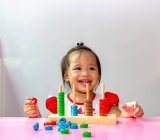 Toddler playing an educational game. — Stock Photo