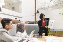Young multicultural business people working in modern office — Stock Photo