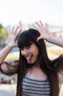 Young asian woman making funny faces to camera — Stock Photo