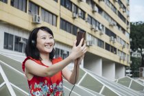 Asian tourist woman taking selfie — Stock Photo