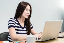 Young woman working startup environment. — Stock Photo