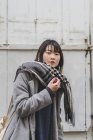 Young attractive casual asian woman in coat — Stock Photo