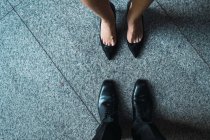 Cropped image of feet of business people — Stock Photo