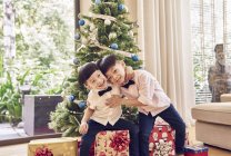 Happy young asian boys celebrating christmas together — Stock Photo