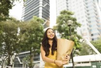 Young chinese woman at grocery shopping — Stock Photo