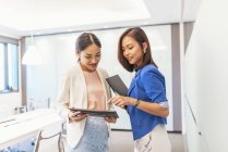 Young attractive asian women working in office — Stock Photo