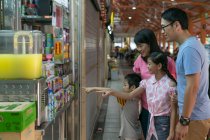 RELEASES Happy asian family during shopping together — Stock Photo