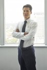 Young successful businessman working in modern office — Stock Photo