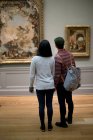 Rear view of asian tourists in The Metropolitan Museum of Art, New York, USA — Stock Photo