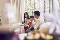 Happy asian family celebrating christmas together — Stock Photo