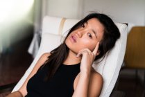 Sexy Chinese woman looking at the camera — Stock Photo