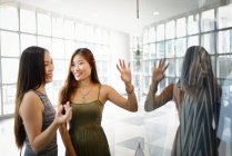 Young attractive asian women spending time together — Stock Photo