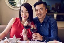 RELEASES Happy young asian couple celebrating christmas together — Stock Photo