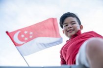 A proud Singaporean kid. — Stock Photo