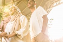 Young muslim group smiling on MRT staircase gazing — Stock Photo