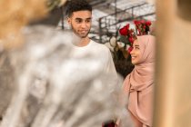 Young muslim couple in flower shop — Stock Photo