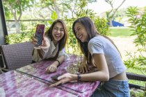 Two young beautiful ladies taking a selfie. — Stock Photo