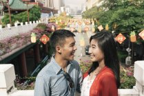 Young happy asian couple spending time in Chinatown — Stock Photo