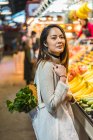 Young attractive asian woman at shopping in food market — Stock Photo