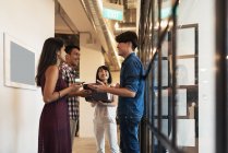 Young asian people at work with in modern office — Stock Photo