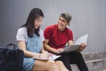 Young asian college students studying together — Stock Photo