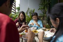 Young asian family celebrating Hari Raya in Singapore — Stock Photo